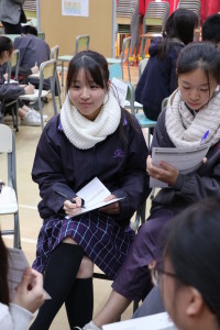 Student is listening carefully to the mentor's instructions.